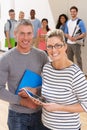 Portrait Of Male And Female Tutors In Class With Students Royalty Free Stock Photo