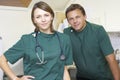 Portrait Of Male And Female Vets In Surgery Royalty Free Stock Photo