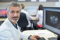 Portrait male healthworker using computer