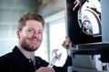 Portrait Of Male Heating Engineer With Adjustable Wrench Servicing Boiler Royalty Free Stock Photo