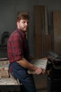 Portrait Male Master carpenter apron in his workshop. Small business