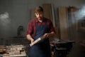 Portrait Male Master carpenter apron in his workshop. Small business