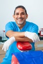 Portrait of a male middle -aged dentist at his office Royalty Free Stock Photo