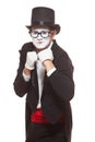 Portrait of male mime artist performing, isolated on white background. Mime in a stand ready to box. Symbol of fight