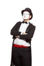 Portrait of a male mime artist performing, isolated on white background. Symbol of superiority, arrogance, pride