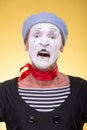 Portrait of male mime isolated on yellow