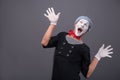 Portrait of male mime white funny face and