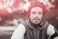 Portrait of male mountain biker riding bicycle in forest Royalty Free Stock Photo