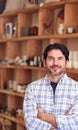 Portrait Of Male Owner Of Gift Store Standing In Front Of Shelves With Cosmetics And Candles Royalty Free Stock Photo