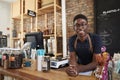 Portrait Of Male Owner Of Sustainable Plastic Free Grocery Store Behind Sales Desk