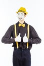 Portrait of a male, pantomime actor looking at camera and showing thumb up. Royalty Free Stock Photo