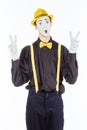 Portrait of a male, pantomime actor looking at camera and showing thumb up. Royalty Free Stock Photo