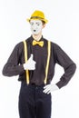 Portrait of a male, pantomime actor looking at camera and showing thumb up. Royalty Free Stock Photo