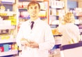 Portrait of male pharmacists working in modern farmacy Royalty Free Stock Photo