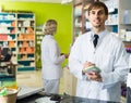 Portrait of male pharmacists working in modern farmacy Royalty Free Stock Photo