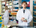 Portrait of male pharmacists working in modern farmacy Royalty Free Stock Photo