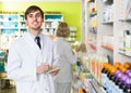 Portrait of male pharmacists working in modern farmacy Royalty Free Stock Photo