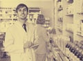 Portrait of male pharmacists working in modern farmacy Royalty Free Stock Photo