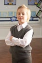 Portrait Of Male Primary School Pupil Standing In Royalty Free Stock Photo