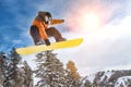 Portrait of Male Snowboarder with lens flare