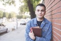 Portrait of a male student holding books outdoors Royalty Free Stock Photo