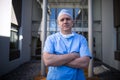 Portrait of male surgeon standing with arms crossed Royalty Free Stock Photo