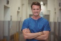 Portrait of male surgeon standing in corridor Royalty Free Stock Photo