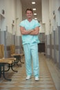 Portrait of male surgeon standing in corridor Royalty Free Stock Photo