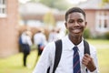 Portrait Of Male Teenage Student In Uniform Outside Buildings