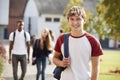 Portrait Of Male Teenage Student Walking Around College Campus Royalty Free Stock Photo