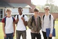 Portrait Of Male Teenage Students Walking Around College Campus Royalty Free Stock Photo