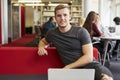 Portrait Of Male University Student Working In Library Royalty Free Stock Photo