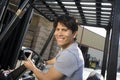 Portrait Of A Male Worker Driving Forktruck Royalty Free Stock Photo