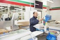 Male worker weighing products in grocery store Royalty Free Stock Photo