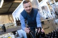 portrait male worker in wine bottling plant