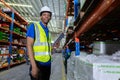 Portrait man american african looking at camera, Male factory company employee scanning box checking number of products on goods