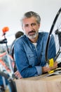 portrait man in bicycle shop Royalty Free Stock Photo