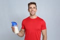 Portrait of man with bottle of protein shake