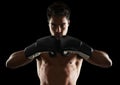 Portrait, man and boxer in stance for training, sports or workout for body health isolated on black background in studio Royalty Free Stock Photo
