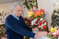 portrait man buying flowers Royalty Free Stock Photo