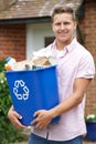 Portrait Of Man Carrying Recycling Bin Royalty Free Stock Photo