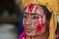 Portrait of a man with Colourful face at Nandgaon Temple during Holi Festival,Uttarpradesh,India