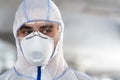 Portrait of man in coronavirus hazmat, mask and glasses