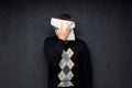 Portrait of man covering his face with paper sheet Royalty Free Stock Photo