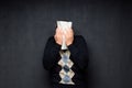 Portrait of man covering his face with paper sheet Royalty Free Stock Photo