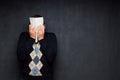 Portrait of man covering his face with paper sheet Royalty Free Stock Photo