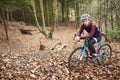 Portrait of man cross-country cycling in a forest Royalty Free Stock Photo