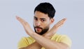 Portrait, man and cross sign for stop, no and protest for rejection, ban and wrong emoji in studio on white background