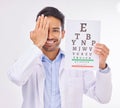 Portrait of man, doctor and eye test with smile in vision clinic, hand on face and eyesight care in India. Healthcare Royalty Free Stock Photo