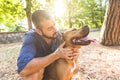 Portrait of a man with dog at park Royalty Free Stock Photo